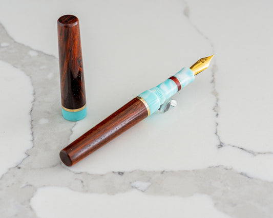 Primary Piece - "Rosewood Skies" | Handmade Cocobolo & Tiffany Blue Resin Fountain Pen w/ Brass & Padauk Accents